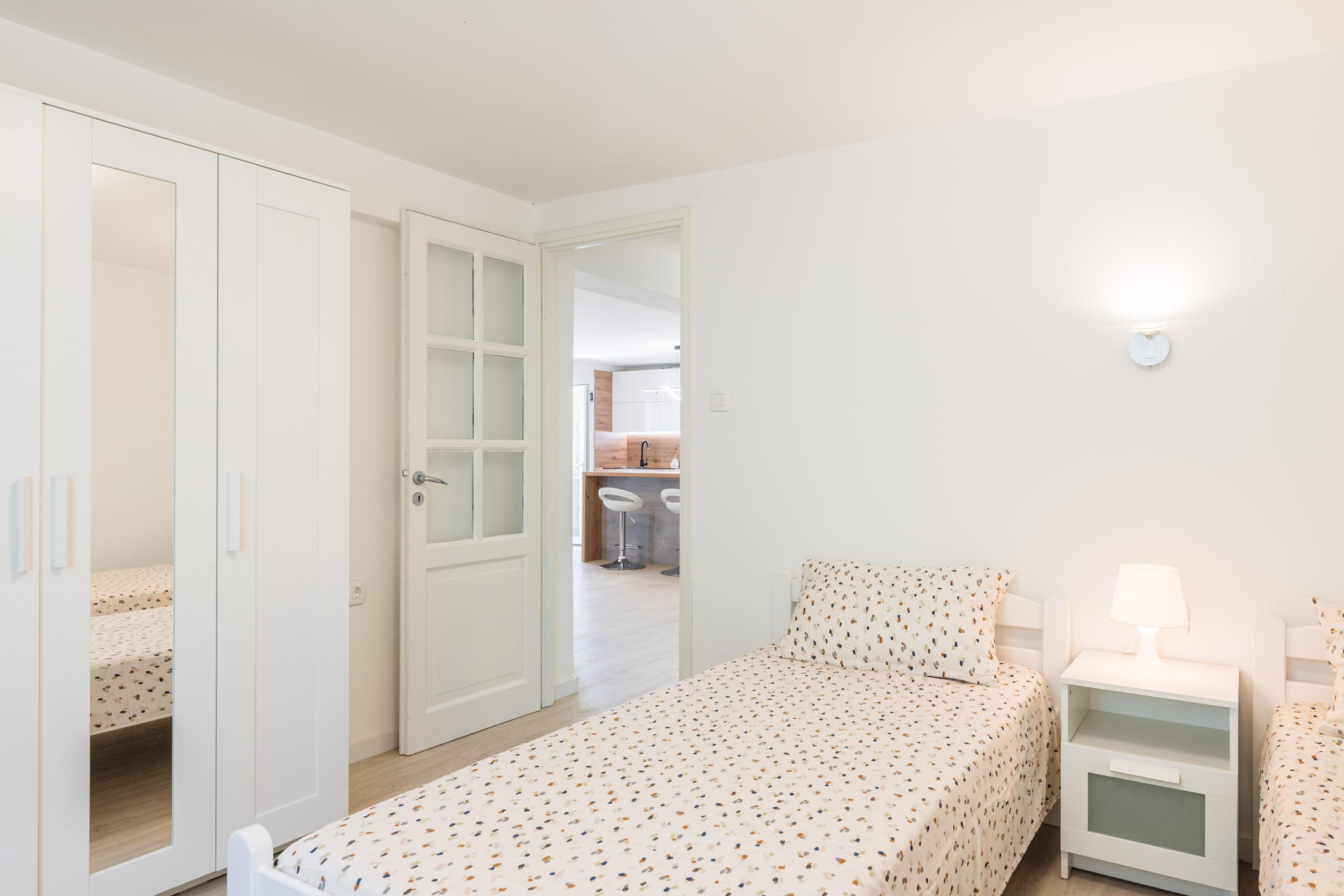 Ground floor bedroom with two single beds