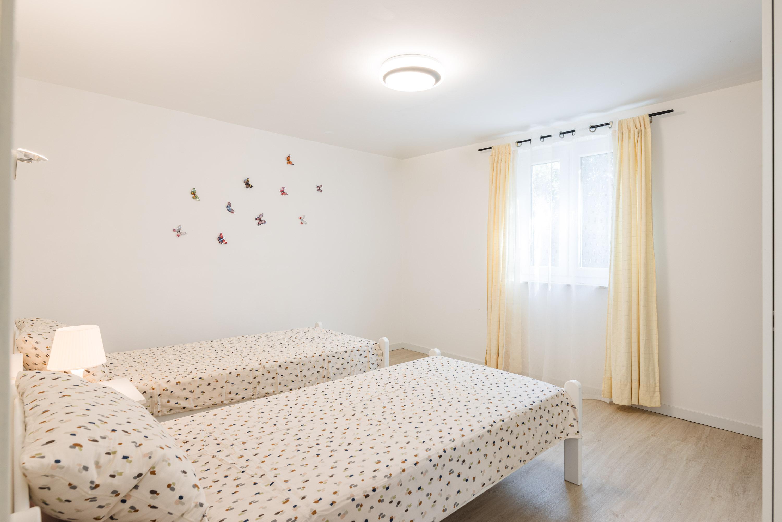 Ground floor bedroom with two single beds